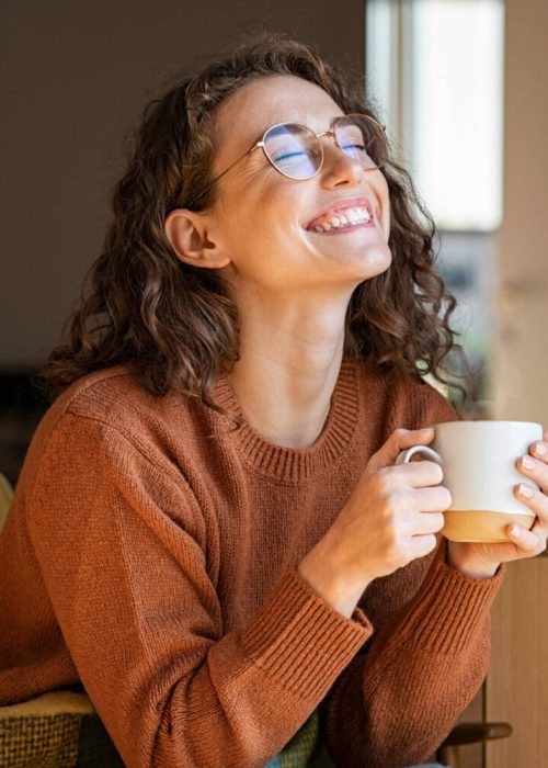 TMJ Treatment Nashville smiling lady with coffee